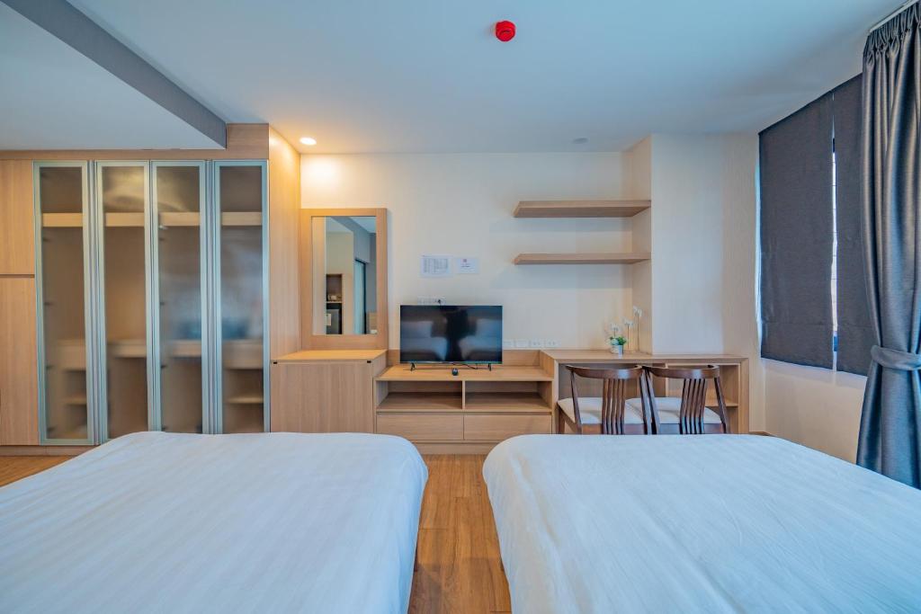 Postel nebo postele na pokoji v ubytování RainTree Condominium