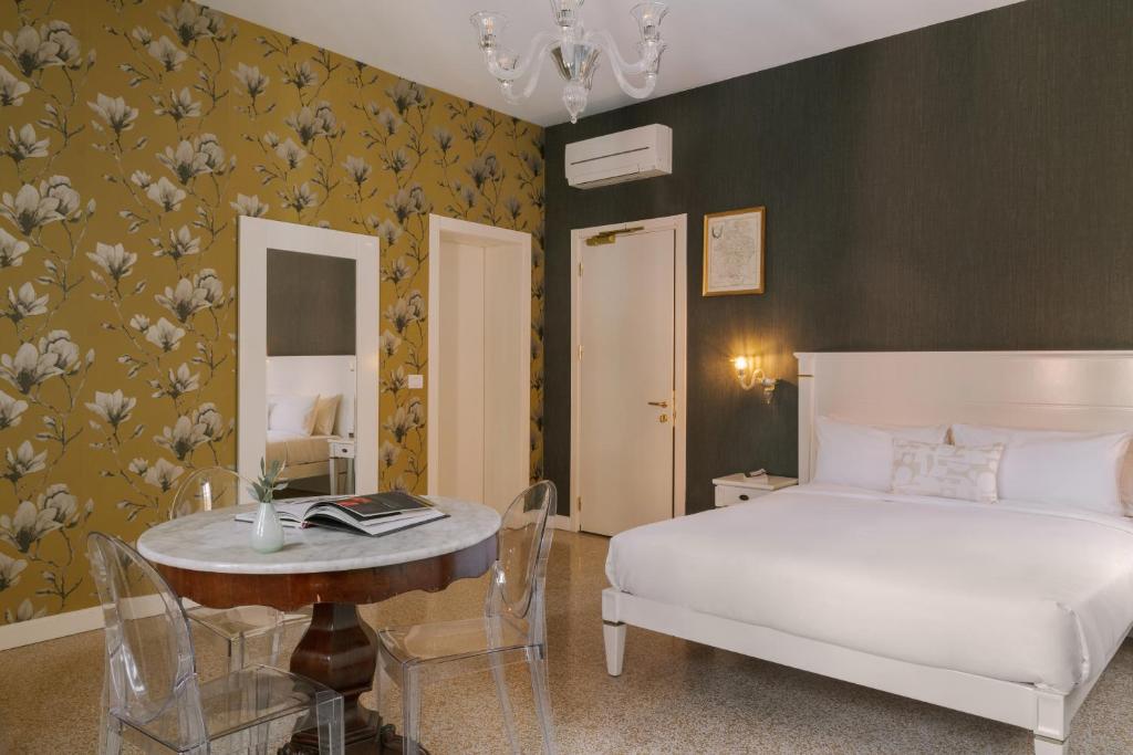 Postel nebo postele na pokoji v ubytování iH Hotels Venezia Salute Palace