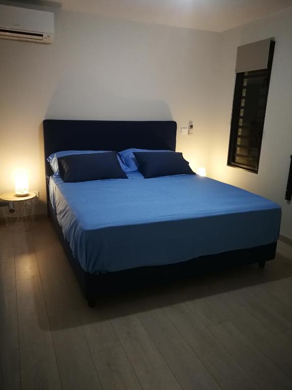 Postel nebo postele na pokoji v ubytování Charmant F2 à SkyNui, piscine de 25m et vue mer