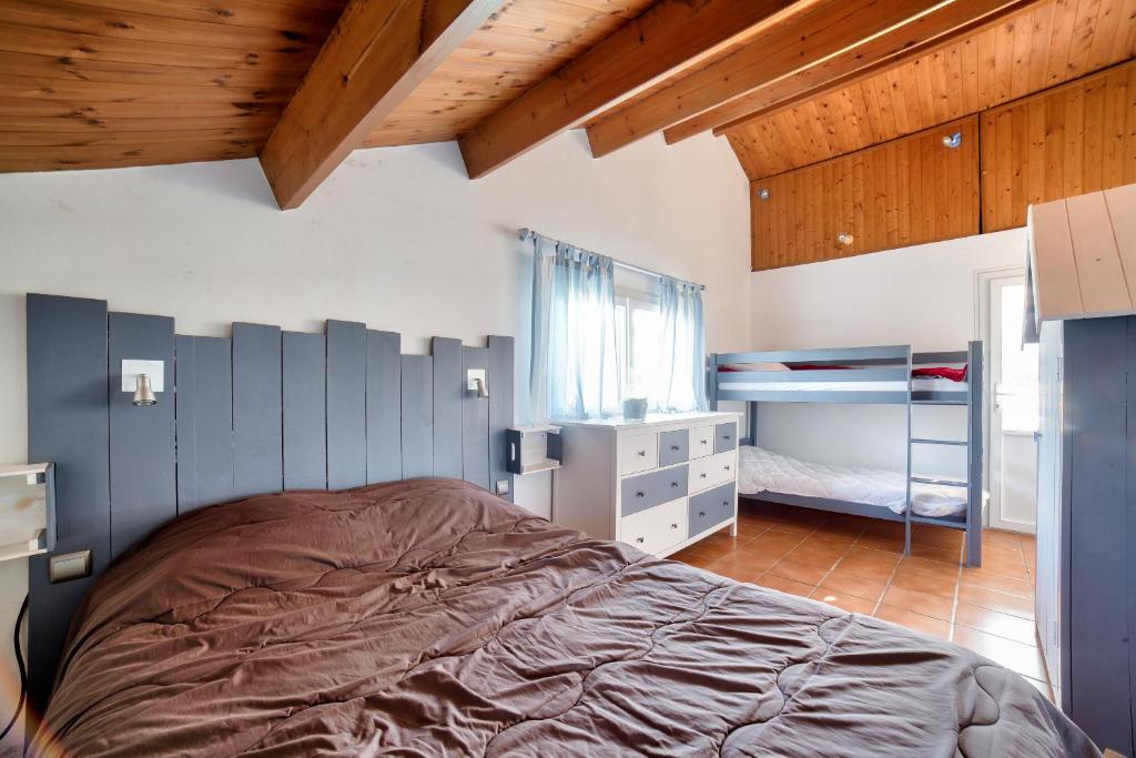 Posteľ alebo postele v izbe v ubytovaní Maison avec jardin à 200m de la plage La Cantine