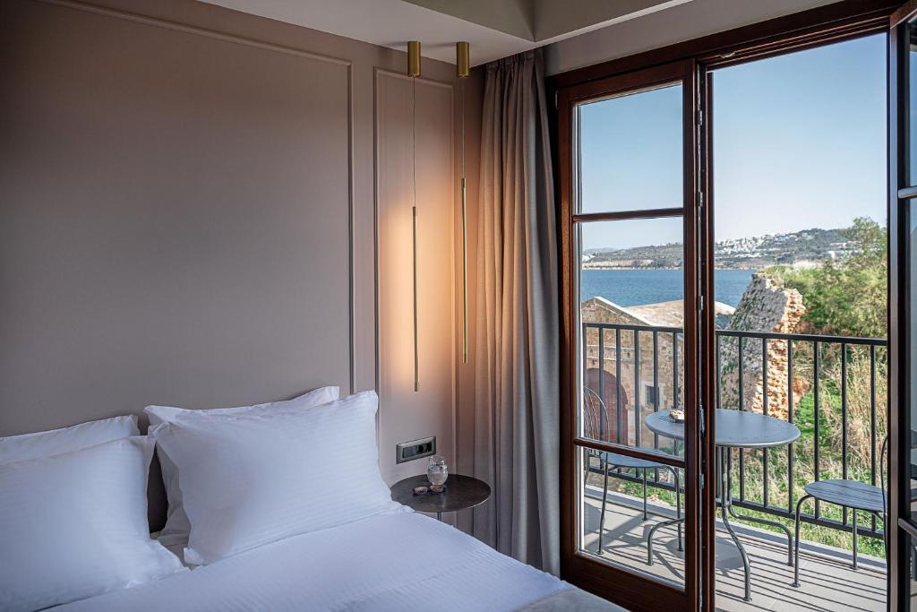 A bed or beds in a room at Ethos Suites
