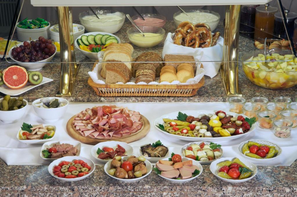 a buffet of different types of food on a table at Hotel Schlicker in Munich