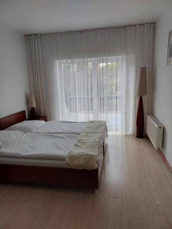 Posteľ alebo postele v izbe v ubytovaní Pensjon Paradise
