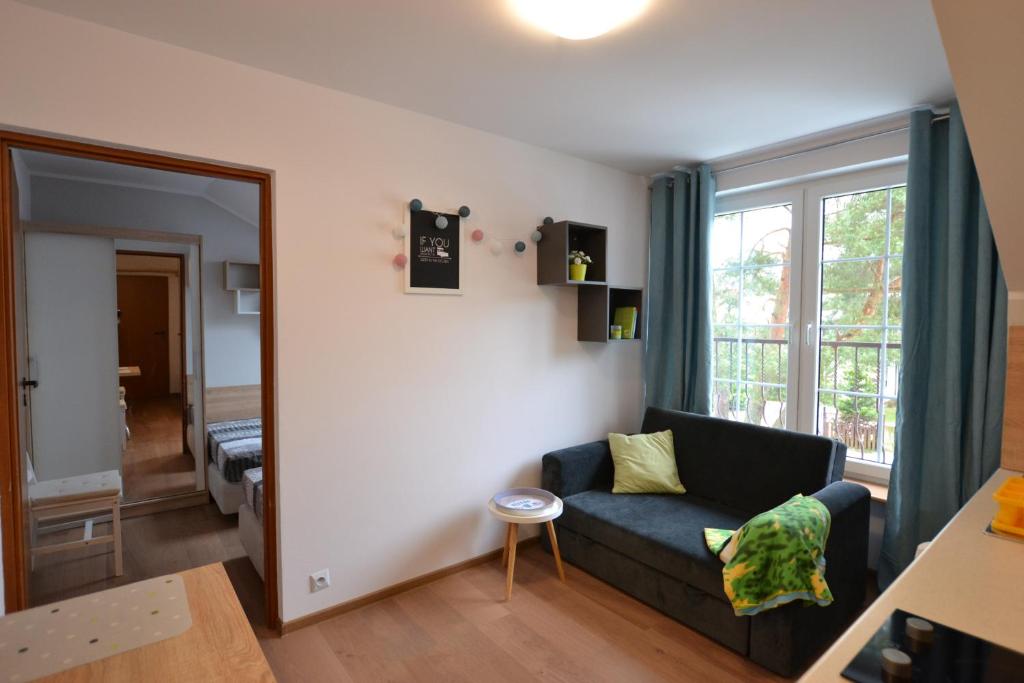 Posedenie v ubytovaní Słoneczne Apartamenty w Poddąbiu