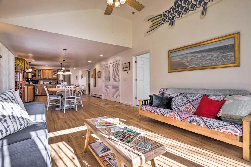 a living room with a couch and a table at Westerly Vacation Home: Town Beach Access in Westerly