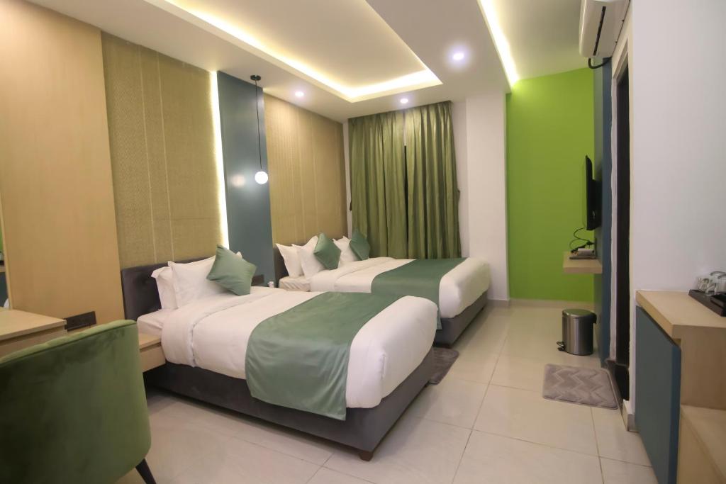 Postel nebo postele na pokoji v ubytování Hotel Aikawa