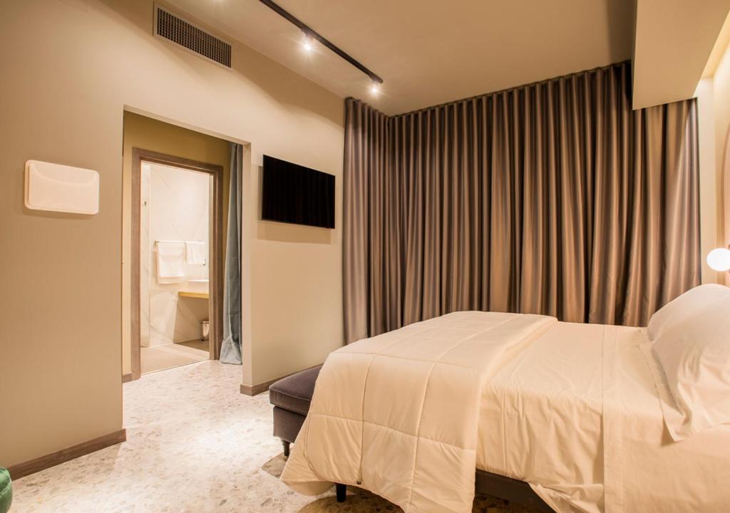 Postel nebo postele na pokoji v ubytování Corso Vittorio B&B