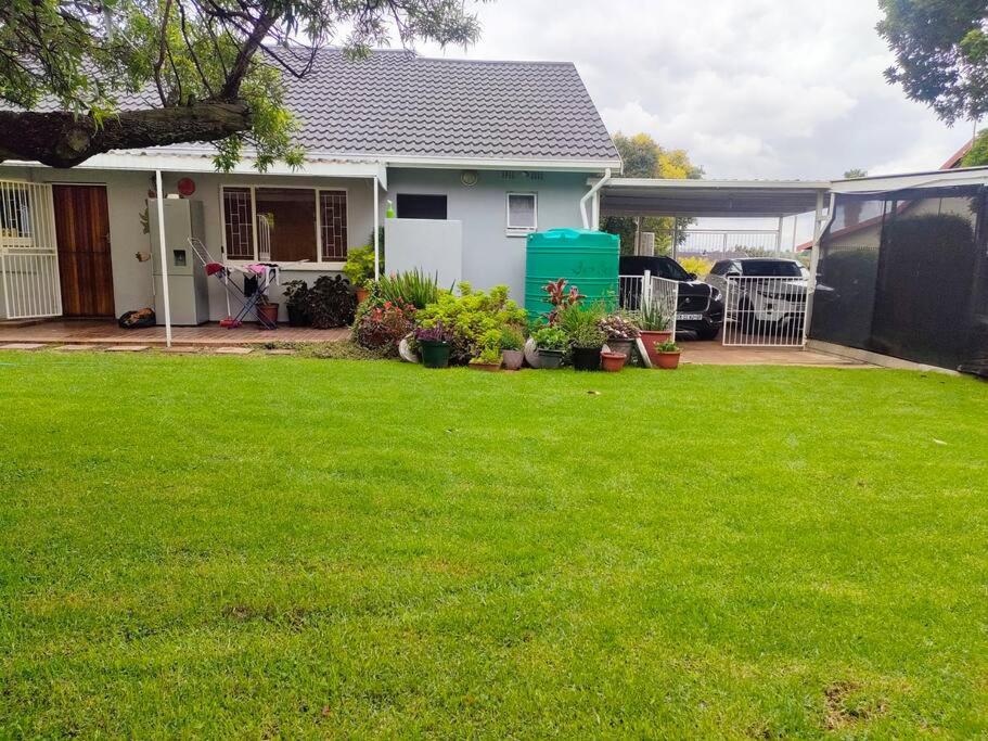 a house with a yard with green grass at Sabie House -3 bedroom house in Kempton Park