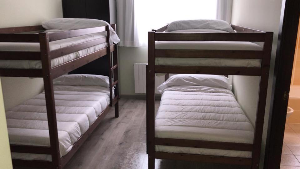 A bed or beds in a room at Las Ermitas de Vallada