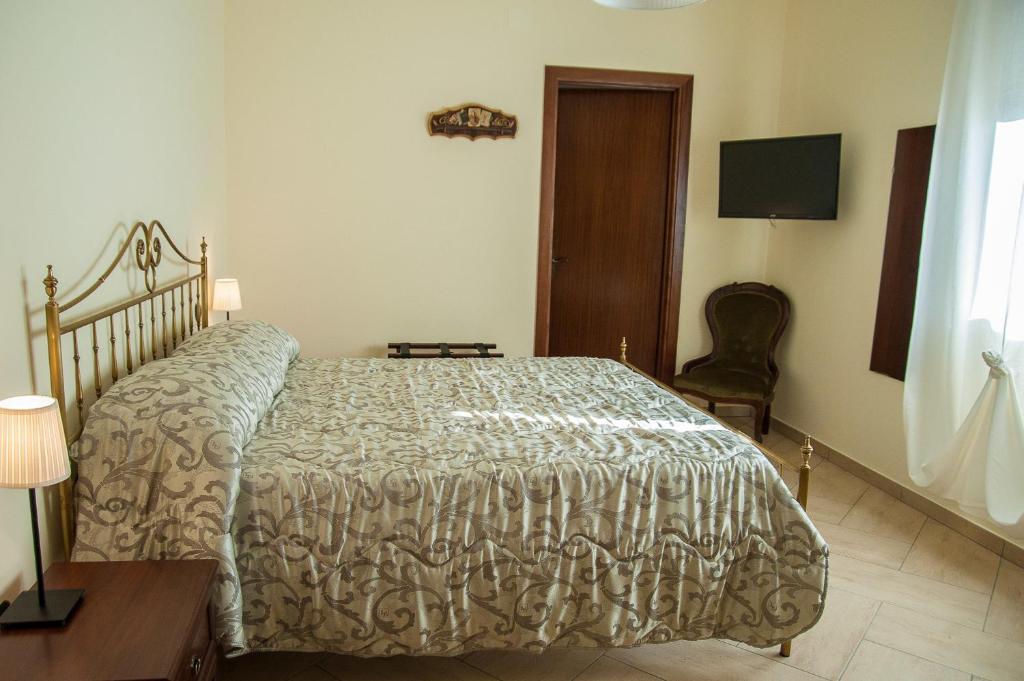 Postel nebo postele na pokoji v ubytování B&B La Cannalia