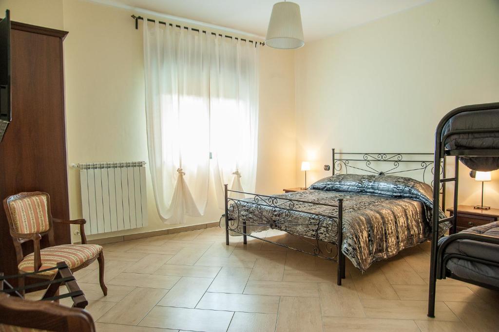 Postel nebo postele na pokoji v ubytování B&B La Cannalia