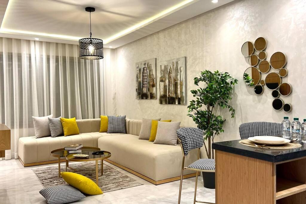 a living room with a couch and a table at The Suite of Artists - Central - By AppartAli in Casablanca
