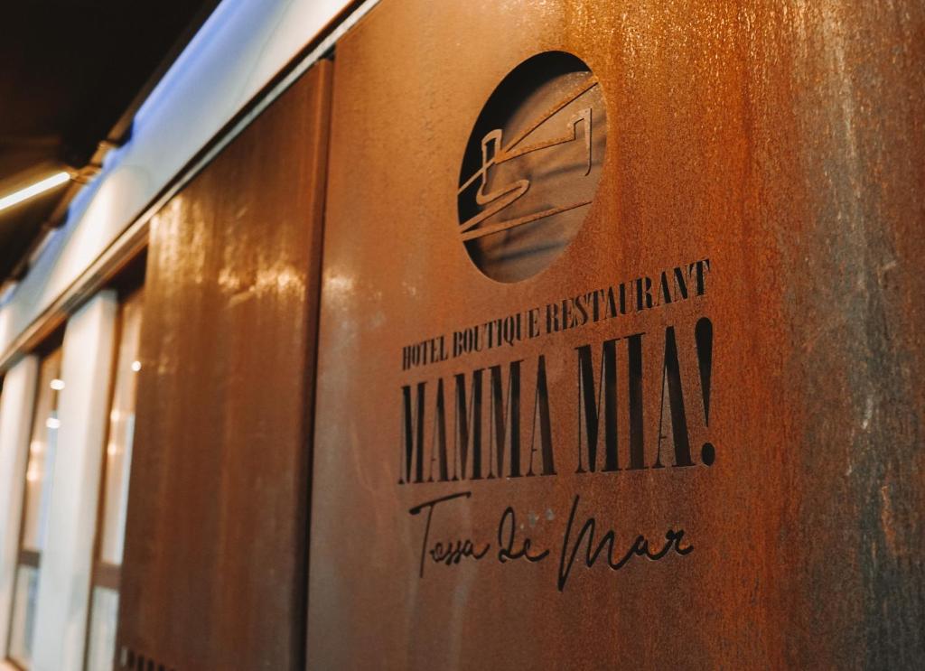 a sign on the side of a train at Mamma Mia Hotel Boutique - Only Adults in Tossa de Mar