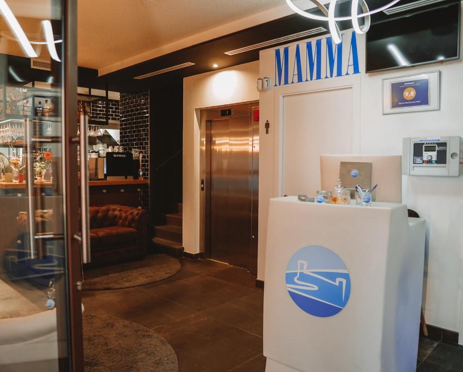 a lobby of a pharmacy with a sign on the door at Mamma Mia Hotel Boutique - Only Adults in Tossa de Mar