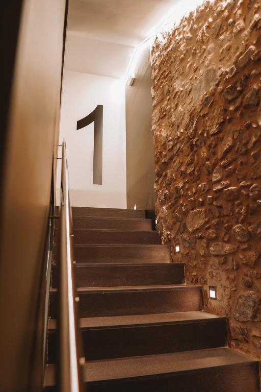 a staircase in a building with the number one on the wall at Mamma Mia Hotel Boutique - Only Adults in Tossa de Mar