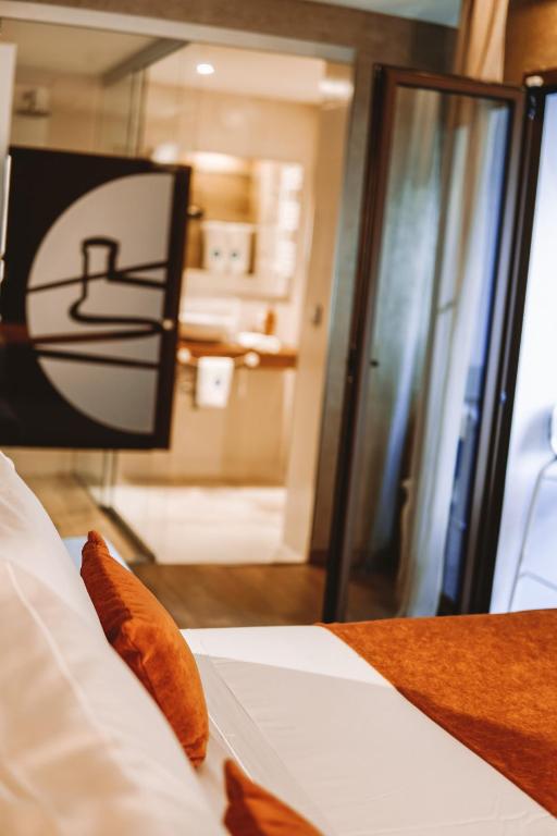 a close up of a bed in a room at Mamma Mia Hotel Boutique - Only Adults in Tossa de Mar