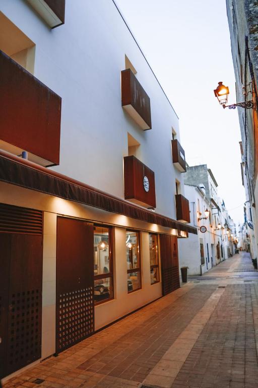 an empty street in front of a building at Mamma Mia Hotel Boutique - Only Adults in Tossa de Mar