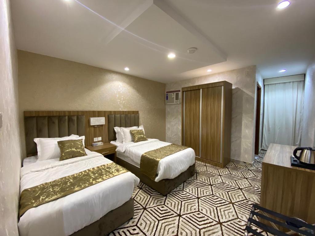Кровать или кровати в номере Seven Mountains Hotel فندق الجبال السبعة