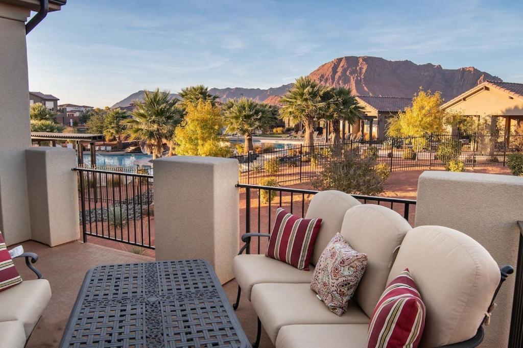 a balcony with couches and a view of a mountain at Paradise Village 32 BBQ Grill, Foosball, Pink Pong, Nintendo Switch and a Resort Style Pool and Water Park in Santa Clara