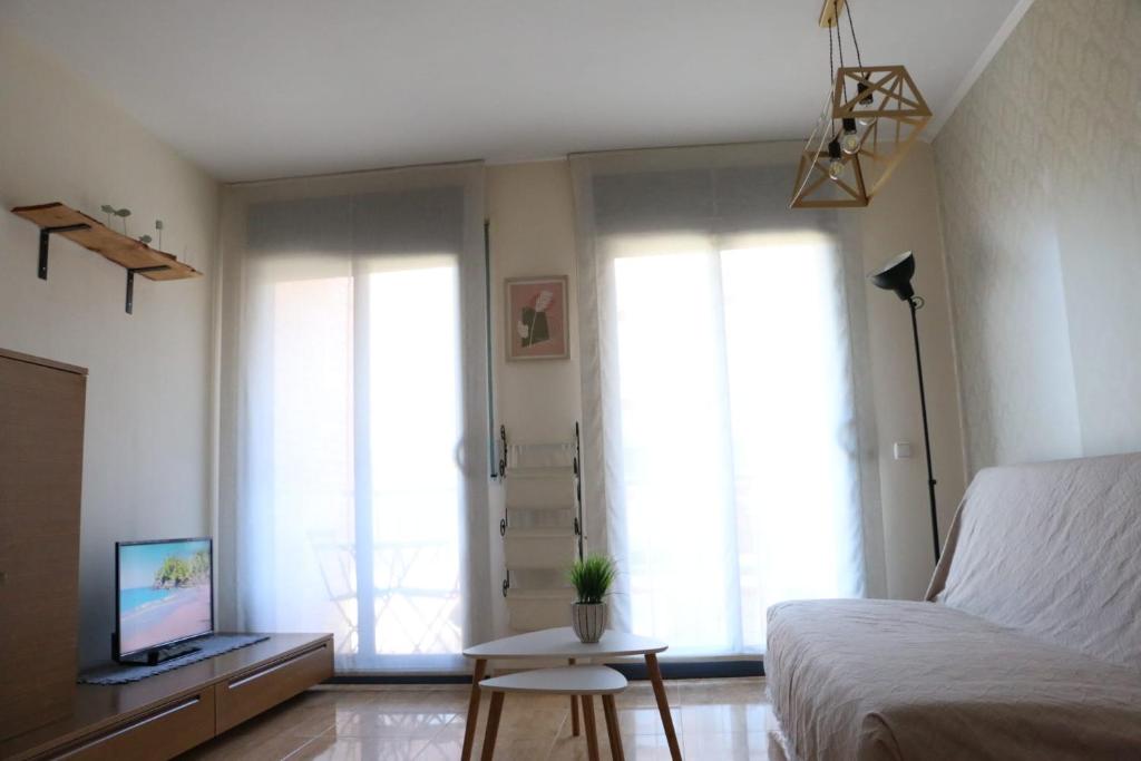 Televízia a/alebo spoločenská miestnosť v ubytovaní Apartamento Solêa