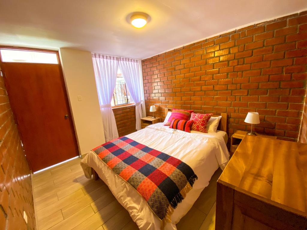 Postel nebo postele na pokoji v ubytování Tupac Huaraz