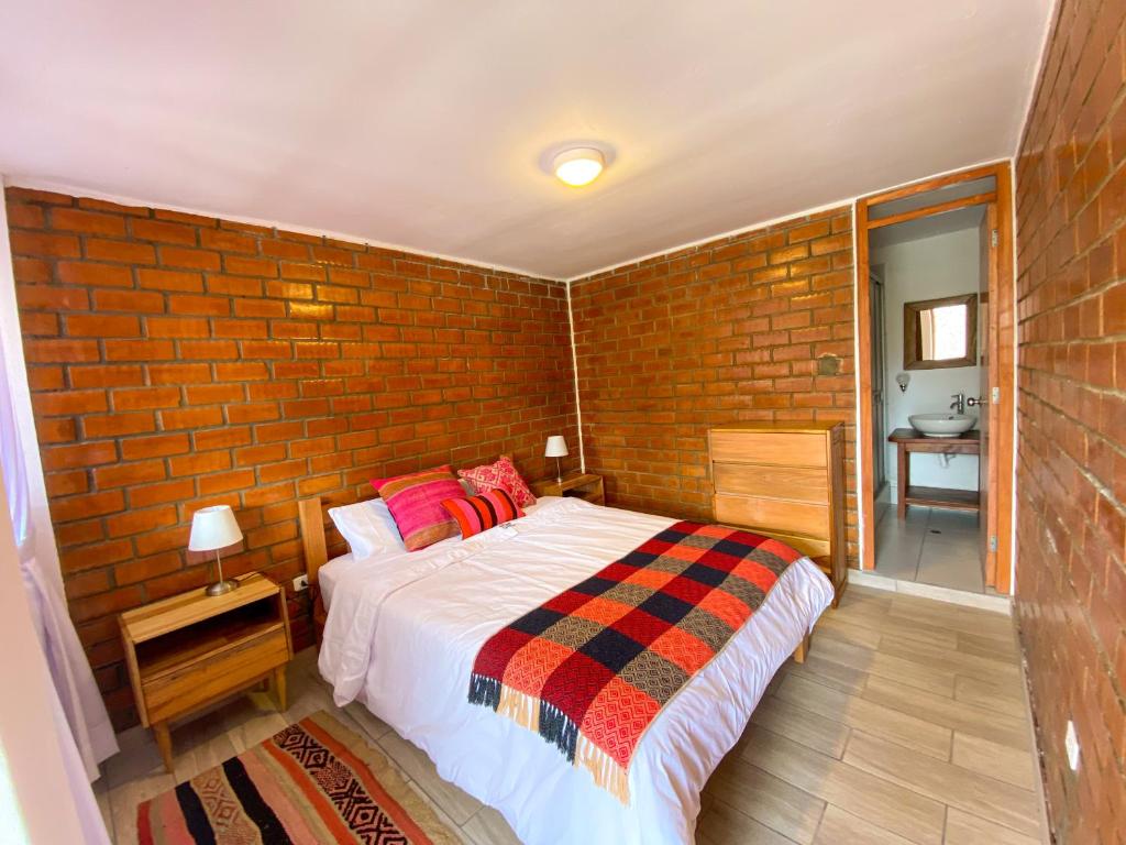 Postel nebo postele na pokoji v ubytování Tupac Huaraz