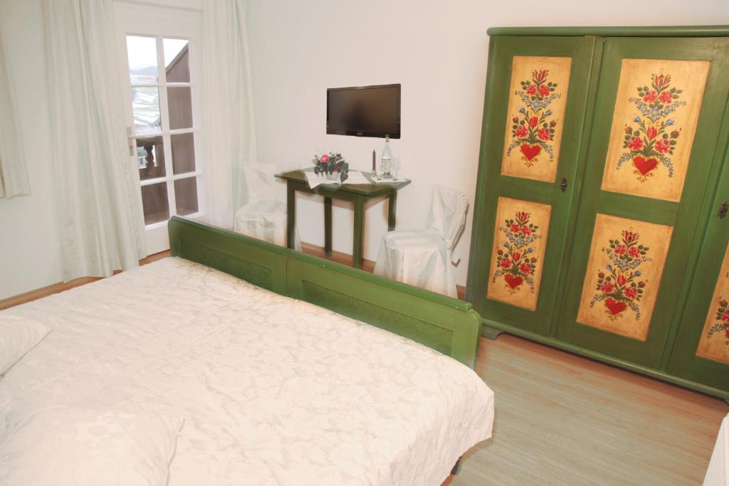 Postel nebo postele na pokoji v ubytování Hotel Garni Georgenhof Adults Only