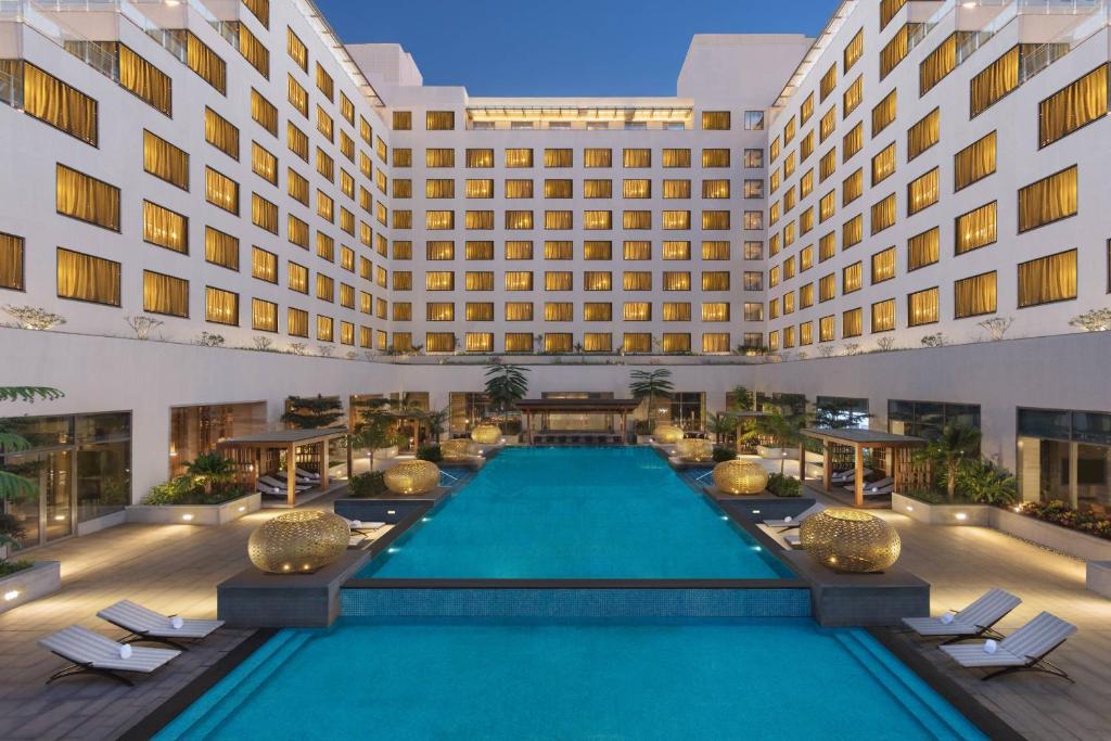 an image of a hotel with a swimming pool at Sheraton Grand Bengaluru Whitefield Hotel & Convention Center in Bangalore