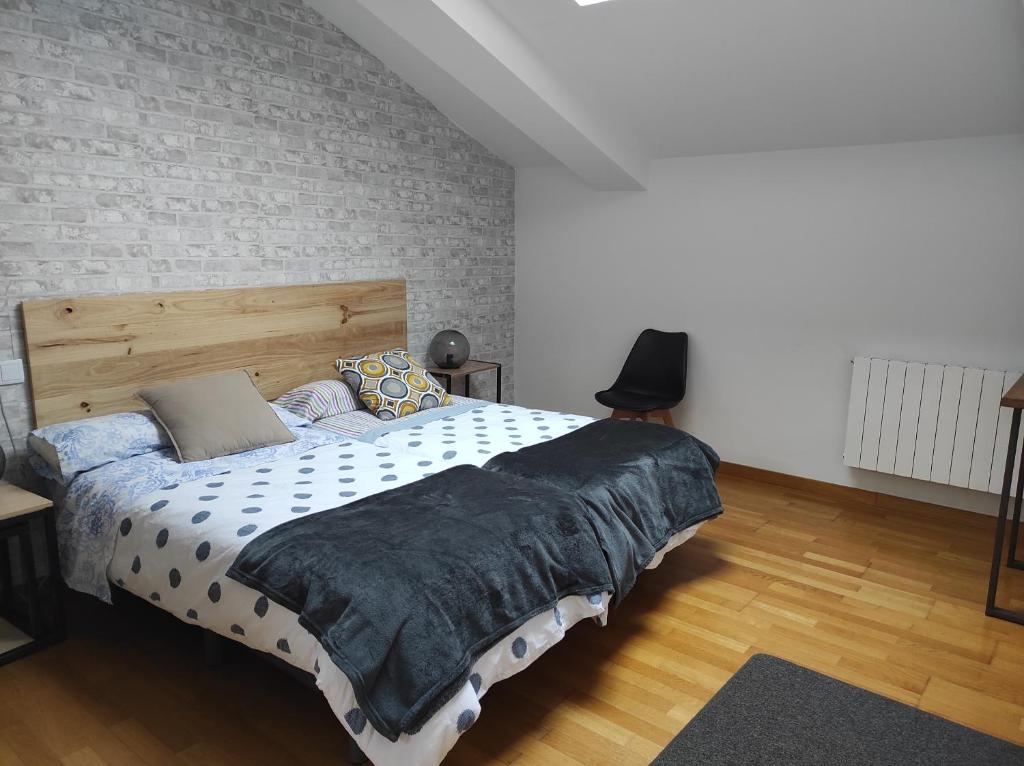 A bed or beds in a room at El Tesoro de Baco
