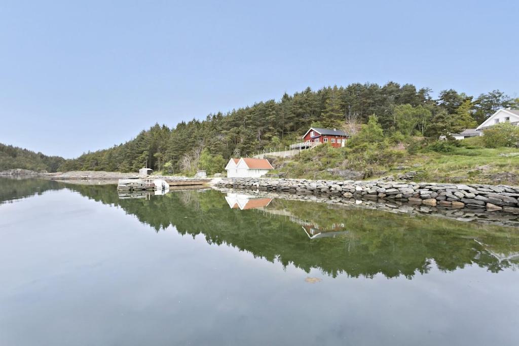 a large body of water with houses and trees at House by the sea - 3 bedrooms and possibility to rent a boat in Stavanger