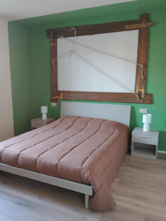 Postel nebo postele na pokoji v ubytování B&B LA VALLUNA