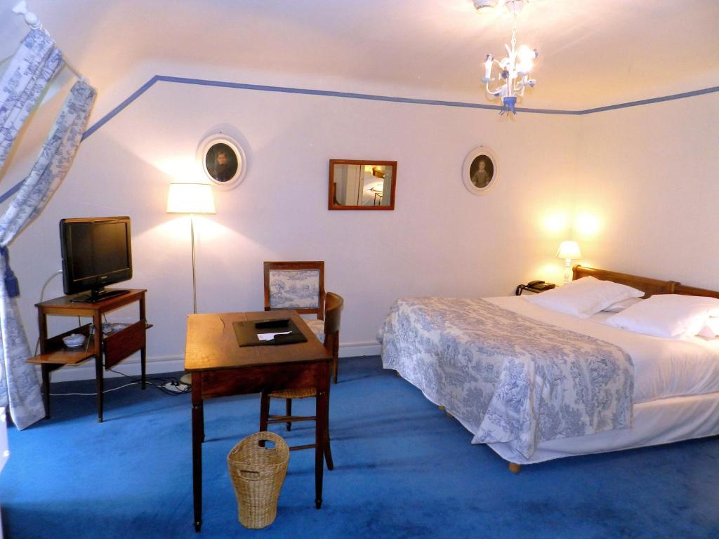 Postel nebo postele na pokoji v ubytování Château d'Urtubie