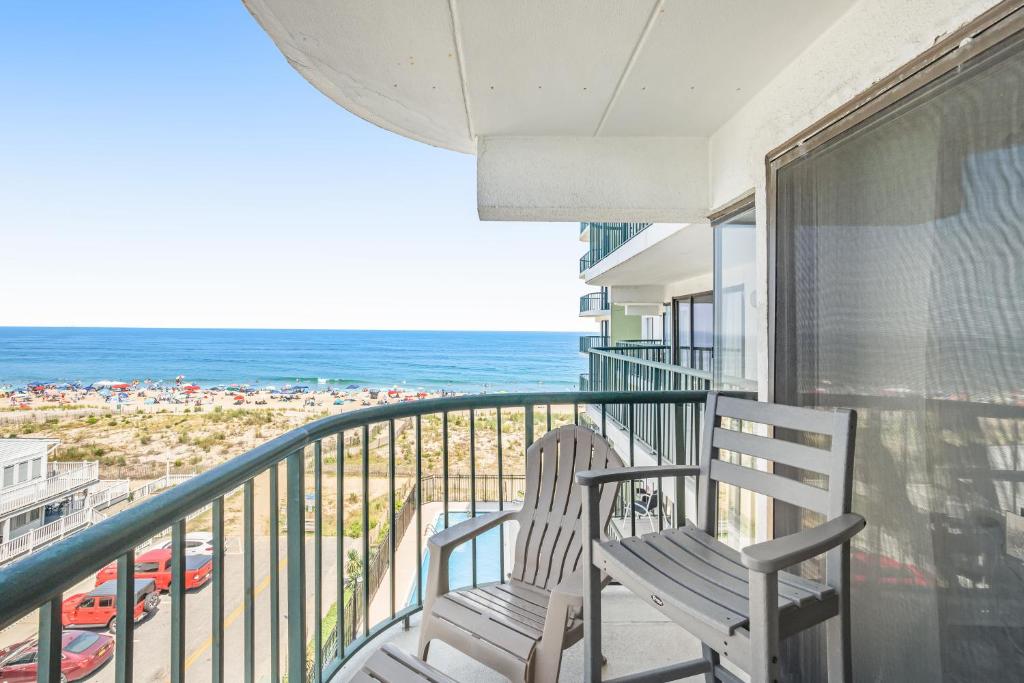 two chairs sitting on a balcony overlooking the beach at Summer Beach 506 in Ocean City