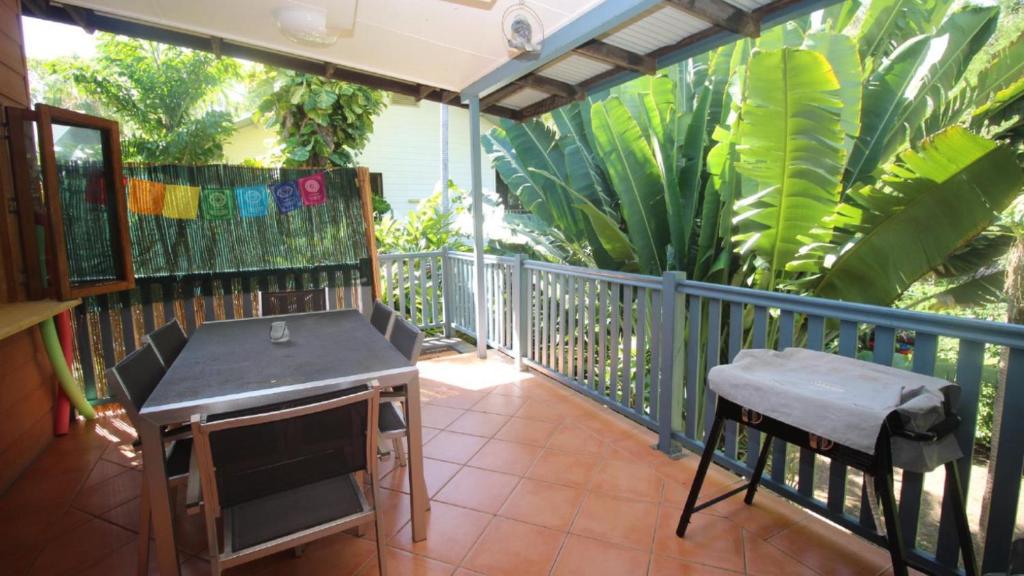 a balcony with a desk and a table on it at Magnetic Dreams Unit 2 in Arcadia