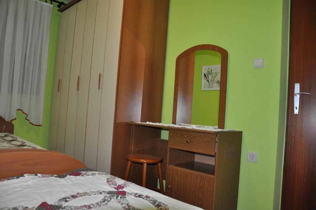 Postel nebo postele na pokoji v ubytování Apartments Kalsan
