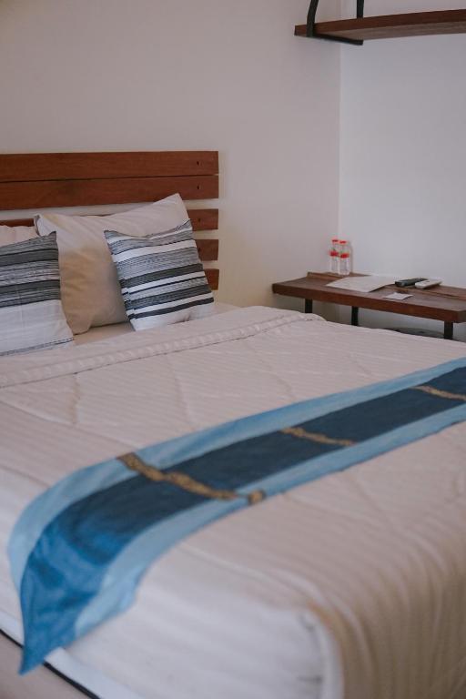 Postel nebo postele na pokoji v ubytování Augustina Home