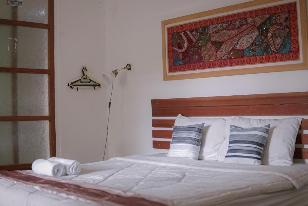 Postel nebo postele na pokoji v ubytování Augustina Home