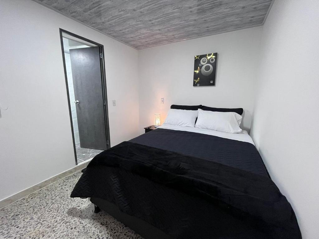 Postel nebo postele na pokoji v ubytování Edificio SantaMarta Medellín