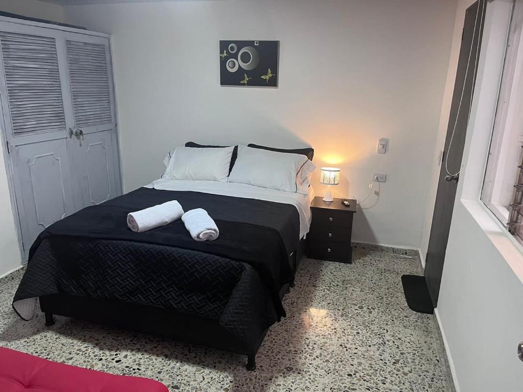 Postel nebo postele na pokoji v ubytování Edificio SantaMarta Medellín