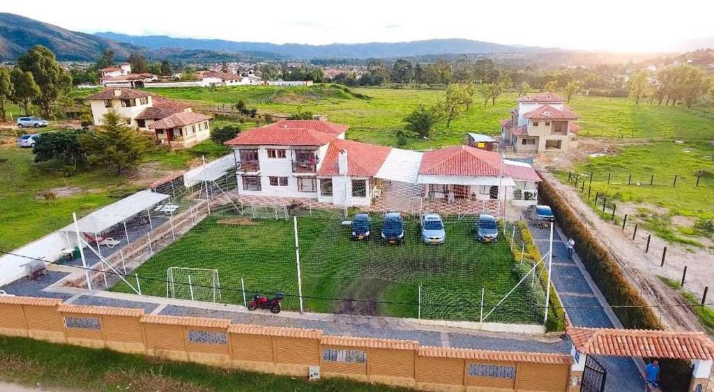 an aerial view of a house with a yard at Hostal Villa Anita in Villa de Leyva