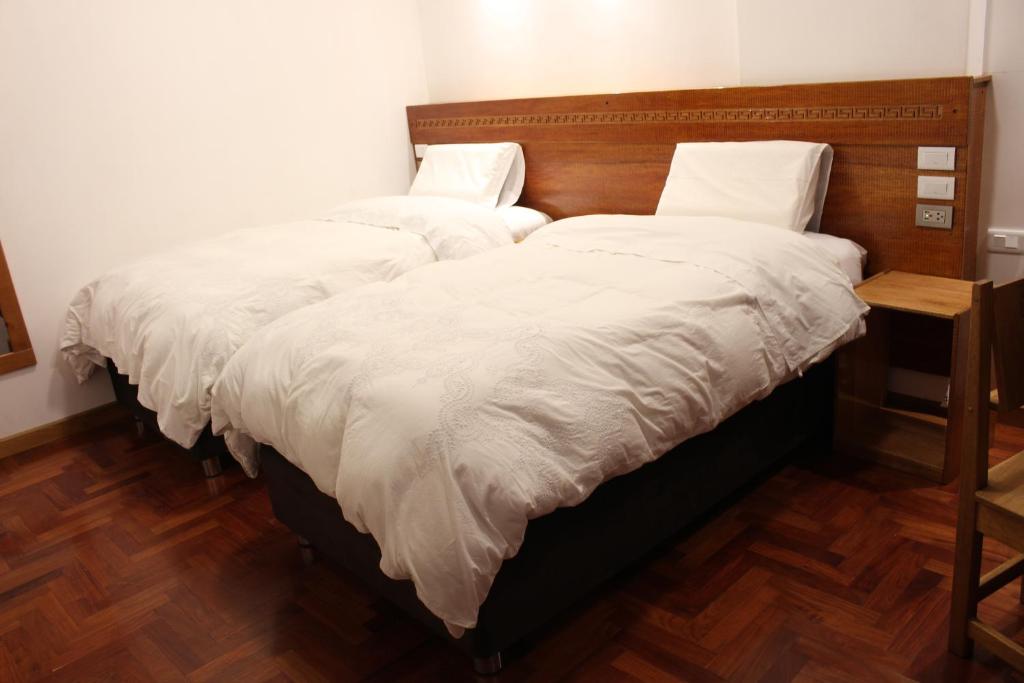 Postel nebo postele na pokoji v ubytování Akilpo Home