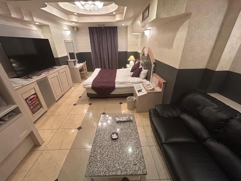 TV a/nebo společenská místnost v ubytování hotel purpleeye