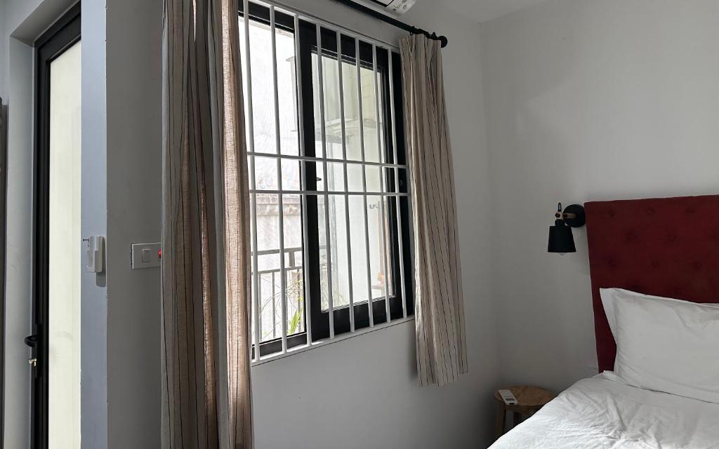 Postel nebo postele na pokoji v ubytování Papilio Homestay Tay Ho