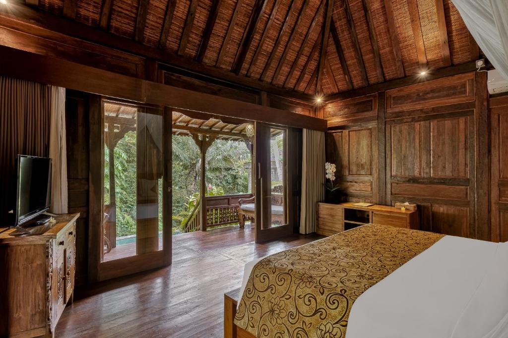 Postel nebo postele na pokoji v ubytování Andara Ubud Villa