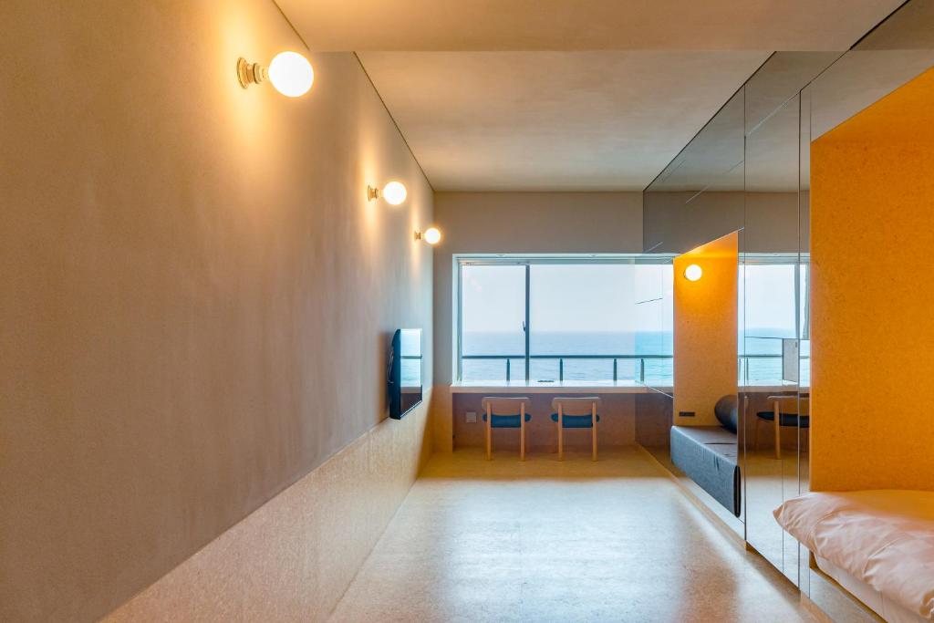 Postel nebo postele na pokoji v ubytování Kameya Hotel