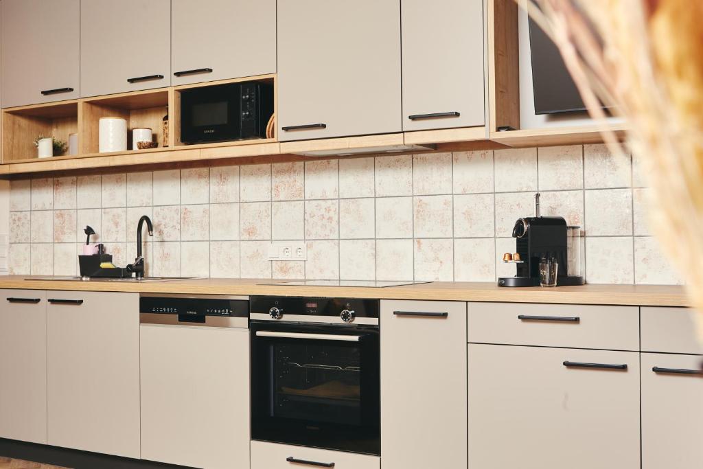 Kuchyň nebo kuchyňský kout v ubytování HOMEBOUND APARTMENTS Bad Goisern - contactless check-in