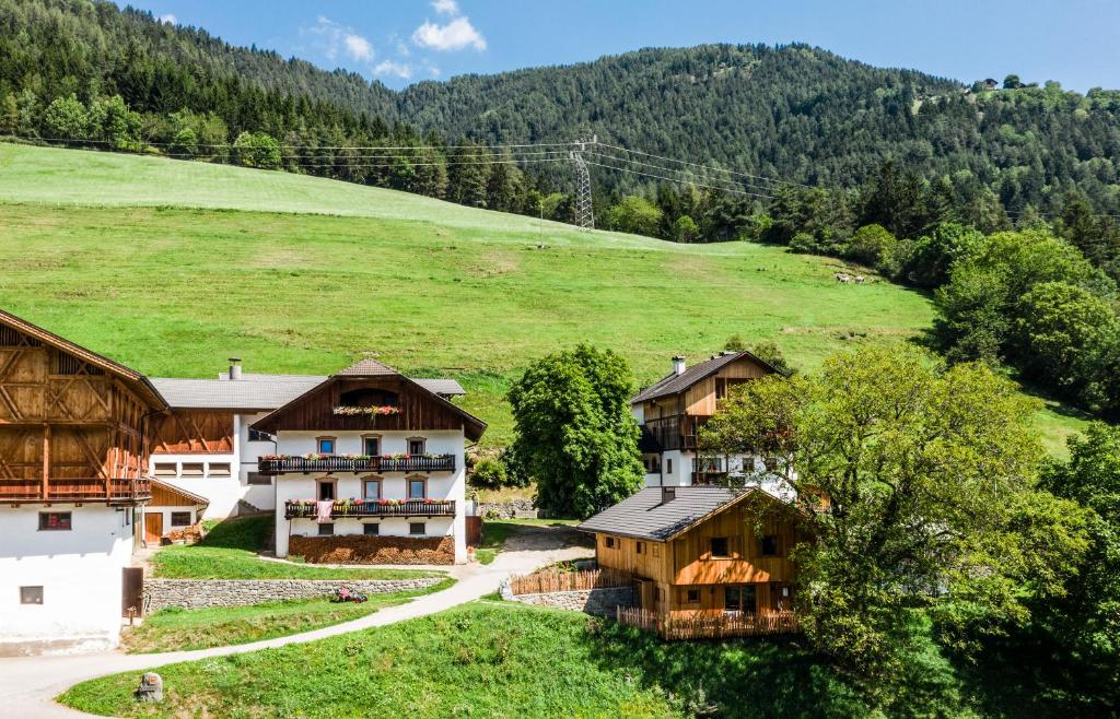 an aerial view of a house in a mountain at Grossplonerhof in Luson