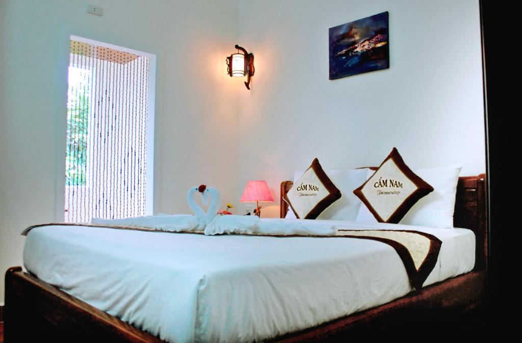 Giường trong phòng chung tại Cam Nam Homestay