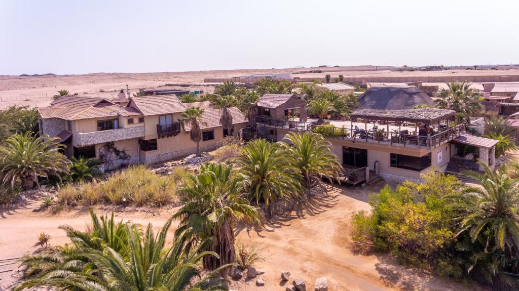 an aerial view of a house with palm trees at Gecko Ridge Guesthouse in Swakopmund