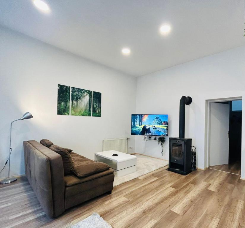 TV a/nebo společenská místnost v ubytování City Apartment mit Direktzugang